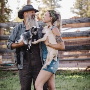 The Humble Goat stead owners, Rick and Ella with baby goats